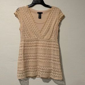 Women’s tan patterned blouse